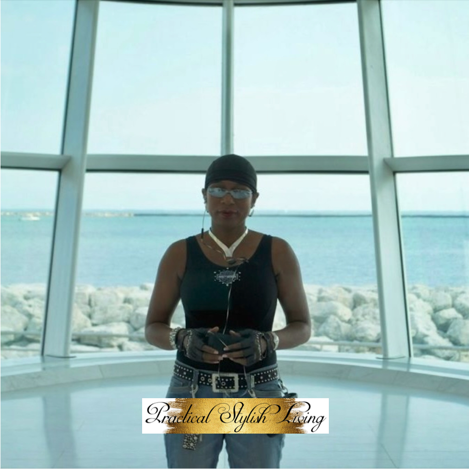 Kimberly R. Jones standing in the Quadracci Pavillion taking in the view of the lake.