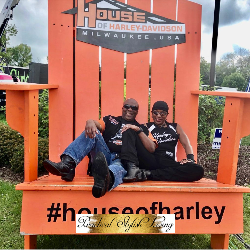 Quirky things to do in Milwaukee, Wisconsin Eric Jones and Kimberly R. Jones sitting in gigantic chair located at the House of Harley-Davidson in Milwaukee, Wisconsin