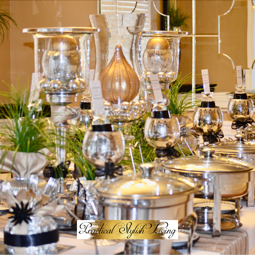 Gold and Silver tablescape with accents of black. Candle holders and chafing dishes