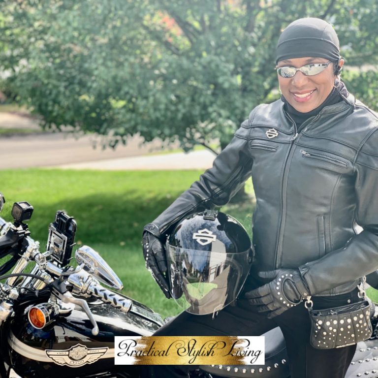 African American Harley-Davidson rider holding her helmet