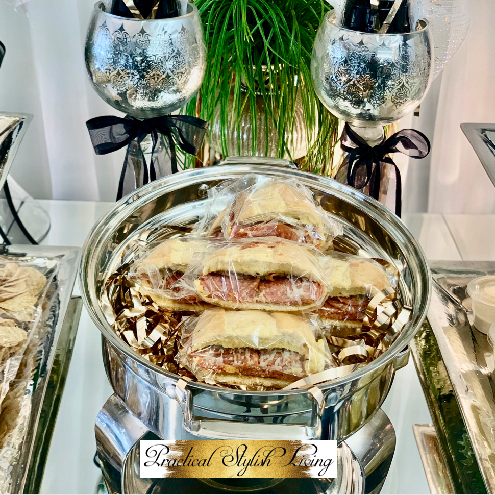 Pepperoni sandwiches prepackaged displayed in elegant silver serving dish. Practical Stylish Living | Luxe Entertaining