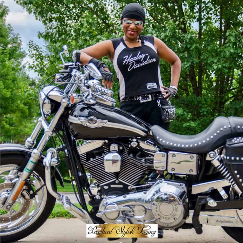 Kimberly R. Jones motorcyclist standing in front of her Harley-Davidson Lowrider