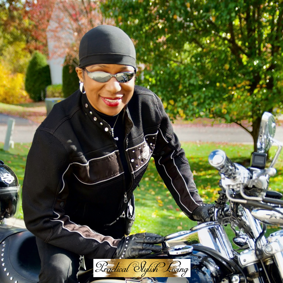 African American female sitting on Harley-Davidson motorcylce