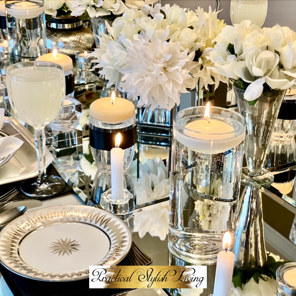 Silver and white mirrored tablesetting with accents of black. Luxury entertaining décor for micro weddings.