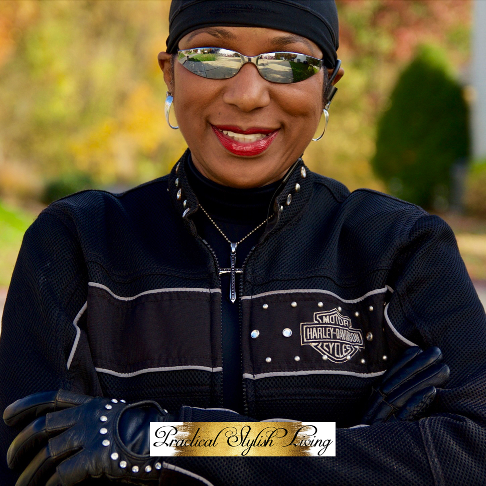 Kimberly R. Jones wearing styled motorcycle riding gloves.